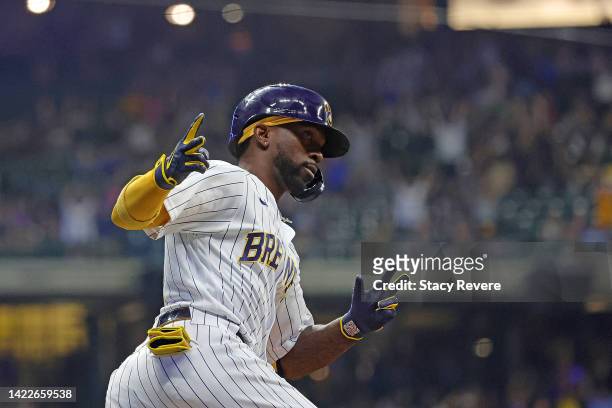 Andrew McCutchen of the Milwaukee Brewers celebrates a two run home run during the eighth inning against the Cincinnati Reds at American Family Field...