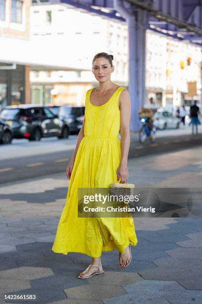 Olivia Palermo wearing yellow dress, bag outside Jason Wu on September 10, 2022 in New York City.