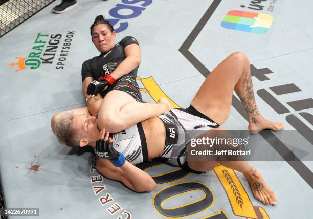 Irene Aldana of Mexico works for a submission against Macy Chiasson in a 140-pound catchweight fight during the UFC 279 event at T-Mobile Arena on...