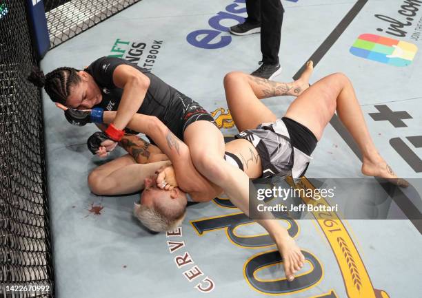 Irene Aldana of Mexico works for a submission against Macy Chiasson in a 140-pound catchweight fight during the UFC 279 event at T-Mobile Arena on...