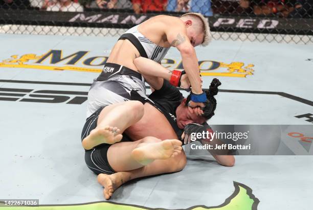 Macy Chiasson punches Irene Aldana of Mexico in a 140-pound catchweight fight during the UFC 279 event at T-Mobile Arena on September 10, 2022 in Las...