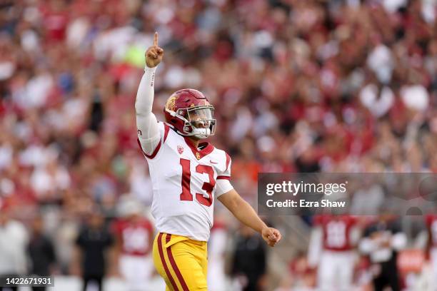 Caleb Williams of the USC Trojans reacts after he threw a touchdown pass against the Stanford Cardinal in the first half at Stanford Stadium on...