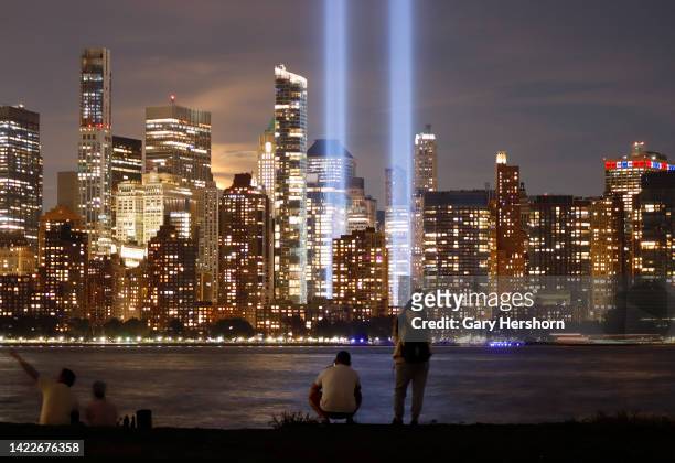 People look at the Tribute in Light as it is illuminated over lower Manhattan one day before the 21st anniversary of the September 11th attacks on...