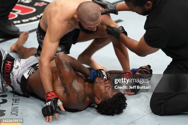 Khamzat Chimaev of Russia reacts after his submission victory over Kevin Holland in a 180-pound catchweight fight during the UFC 279 event at...