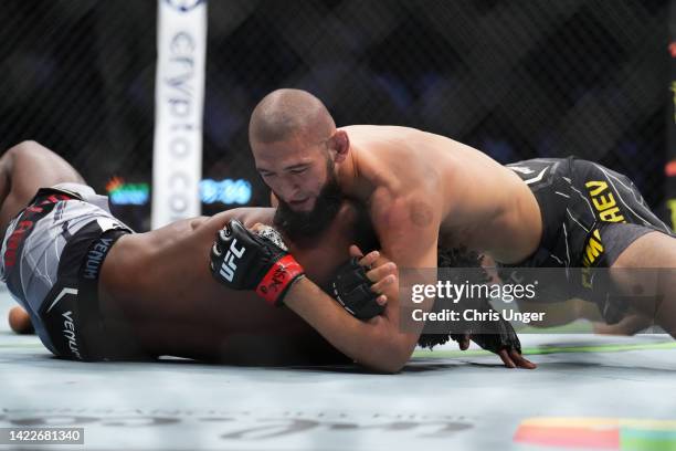 Khamzat Chimaev of Russia works for a submission against Kevin Holland in a 180-pound catchweight fight during the UFC 279 event at T-Mobile Arena on...