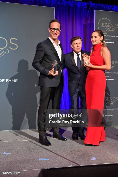 Honorees Richard Weitz and Demi Weitz accept their Joseph F. Cullman 3rd Awards from Bob Costas during the International Tennis Hall of Fame Legends...