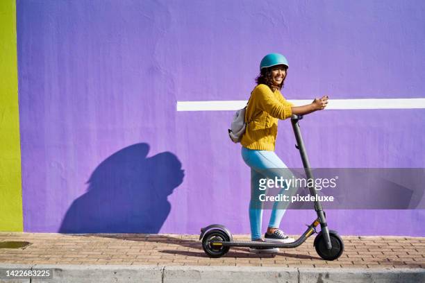 woman, electric scooter and city travel for fashion student by building background with social media phone. happy, cool model on eco friendly, environment carbon footprint and future energy transport - cape town bo kaap stock pictures, royalty-free photos & images