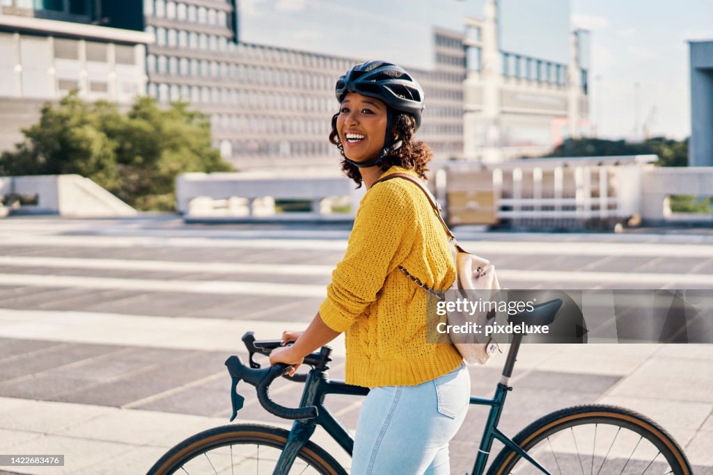 Bike, cycling and green transport of a woman with a happy smile and bicycle. Happiness in a city with eco friendly, sustainable and carbon neutral person transport for sustainability in a urban town