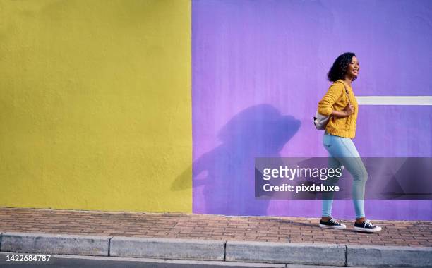 colorful city wall, mockup and woman traveling, urban and tourist in cool, trendy and happy attitude walking town street. advertising, creative copy space and young woman, student or girl cool style - cape town bo kaap stock pictures, royalty-free photos & images