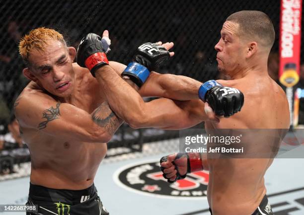 Nate Diaz punches Tony Ferguson in a welterweight fight during the UFC 279 event at T-Mobile Arena on September 10, 2022 in Las Vegas, Nevada.