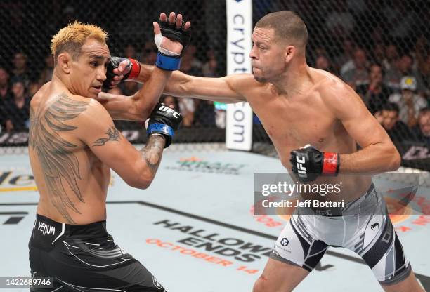 Nate Diaz punches Tony Ferguson in a welterweight fight during the UFC 279 event at T-Mobile Arena on September 10, 2022 in Las Vegas, Nevada.