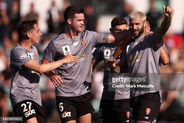 Charlie Austin of Brisbane Roar celebrates scoring a goal with teammates during the Australia Cup Semi Final match between Sydney United 58 FC and...