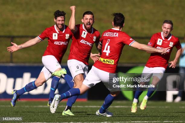 Patrick Antelmi of Sydney United 58 FC celebrates scoring a goal with teammates during the Australia Cup Semi Final match between Sydney United 58 FC...