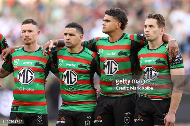 Damien Cook, Cody Walker, Latrell Mitchell and Cameron Murray of the Rabbitohs observe a minute's silence for the passing of Her Majesty Queen...