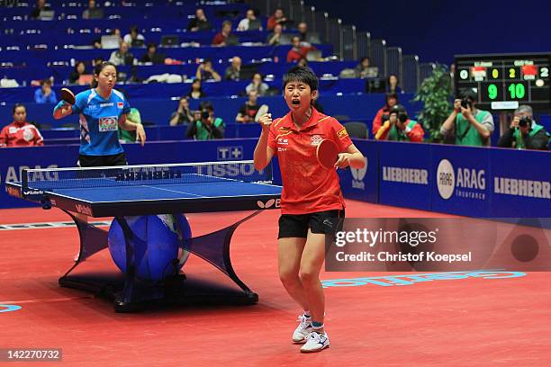 Gue Yue of China celebrates winning her match against Li Jiawei of Germany and winning the LIEBHERR table tennis team world cup 2012 championship...