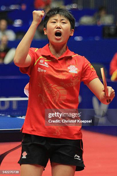 Gue Yue of China celebrates winning her match against Li Jiawei of Germany and winning the LIEBHERR table tennis team world cup 2012 championship...