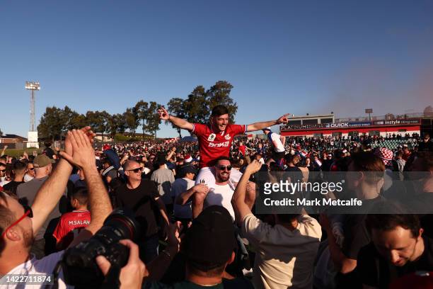 Andrea Agamemnonos of Sydney United 58 FC celebrates victory with fans during the Australia Cup Semi Final match between Sydney United 58 FC and...