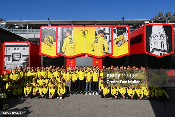 The Ferrari team pose for a photo to commemorate the teams 75th anniversary prior to the F1 Grand Prix of Italy at Autodromo Nazionale Monza on...