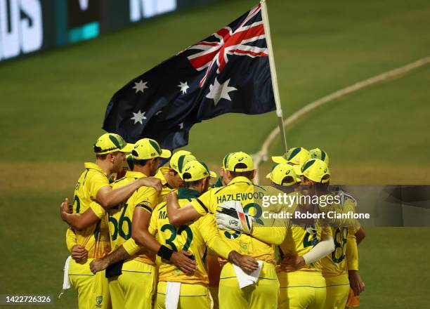 The Australian players huddle during game three of the One Day International Series between Australia and New Zealand at Cazaly's Stadium on...