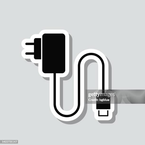 illustrazioni stock, clip art, cartoni animati e icone di tendenza di caricatore del telefono cellulare. adesivo icona su sfondo grigio - adaptor