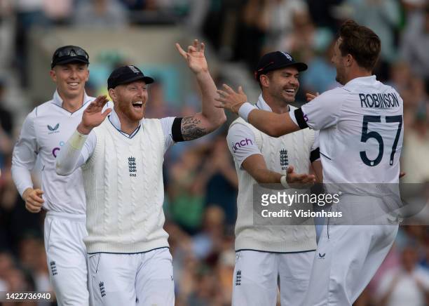 Ollie Robinson of England celebrates with Ben Stokes after taking the wicket of Kyle Verreynne of South Africa during Day Three of the Third LV=...