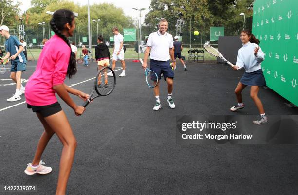 Dan Bloxham, Head Coach at the All England Club gives a coaching session at the Fred Perry Championships at the Brentham Club on September 11, 2022...