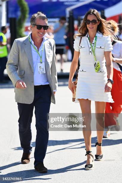 Hugh Grant and Anna Elisabet Eberstein walk in the Paddock prior to the F1 Grand Prix of Italy at Autodromo Nazionale Monza on September 11, 2022 in...