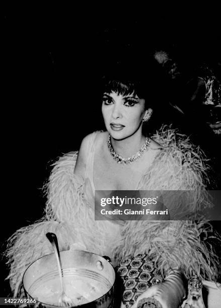 Italian actress Gina Lollobrigida at a fashion show, Rome, 1965.