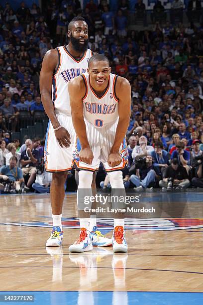 Russell Westbrook of the Oklahoma City Thunder and James Harden of the Oklahoma City Thunder smile during the game between the Chicago Bulls and the...