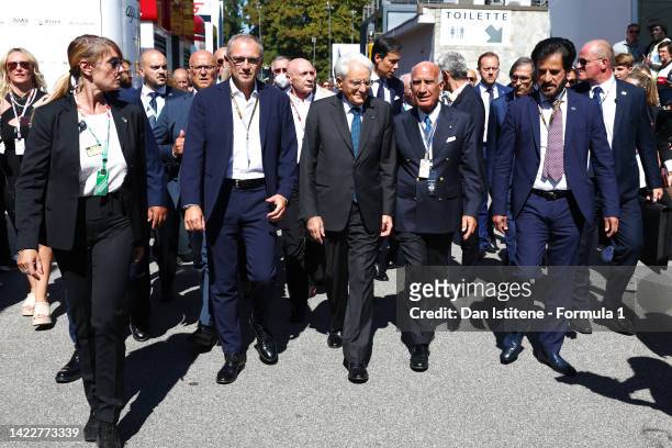 Sergio Mattarella, President of Italy, walks in the Paddock with Stefano Domenicali, CEO of the Formula One Group, and Mohammed ben Sulayem, FIA...