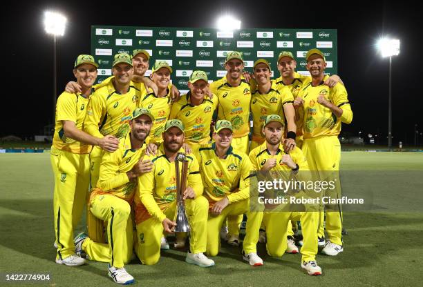 The Australian team pose they defeated New Zealand to win the Chappell–Hadlee Trophy during game three of the One Day International Series between...