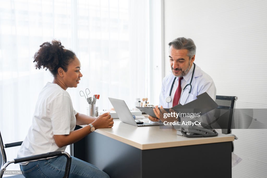 Doctor using stethoscope while examining patient