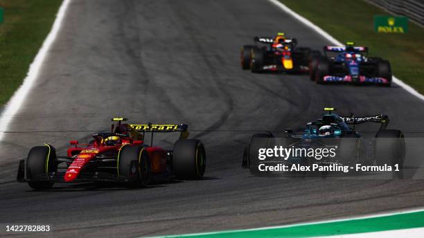 Carlos Sainz of Spain driving the Ferrari F1-75 leads Nicholas Latifi of Canada driving the Williams FW44 Mercedes during the F1 Grand Prix of Italy...