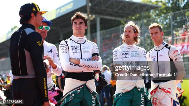 Carlos Sainz of Spain and Ferrari, Fernando Alonso of Spain and Alpine F1,Lance Stroll of Canada and Aston Martin F1 Team, Sebastian Vettel of...