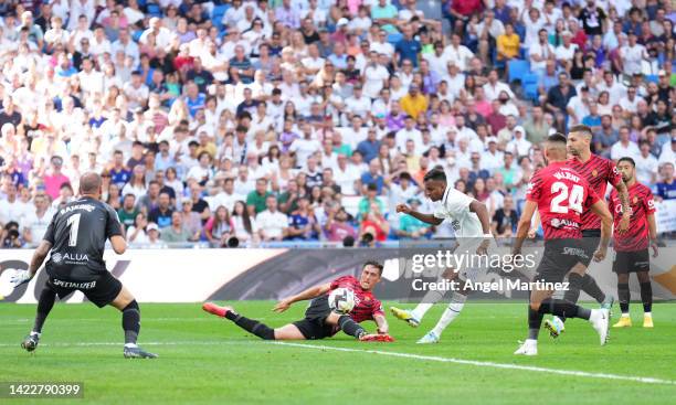 Rodrygo of Real Madrid scores their team's third goal during the LaLiga Santander match between Real Madrid CF and RCD Mallorca at Estadio Santiago...