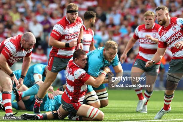 Harry Taylor of Gloucester Rugby tackles Joe Launchbury of Wasps Rugby during the Gallagher Premiership Rugby match between Gloucester Rugby and...