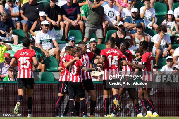 Inaki Williams of Athletic Club celebrates after their sides first goal with teammates, an own goal scored by Nicolas Fernandez of Elche CF during...