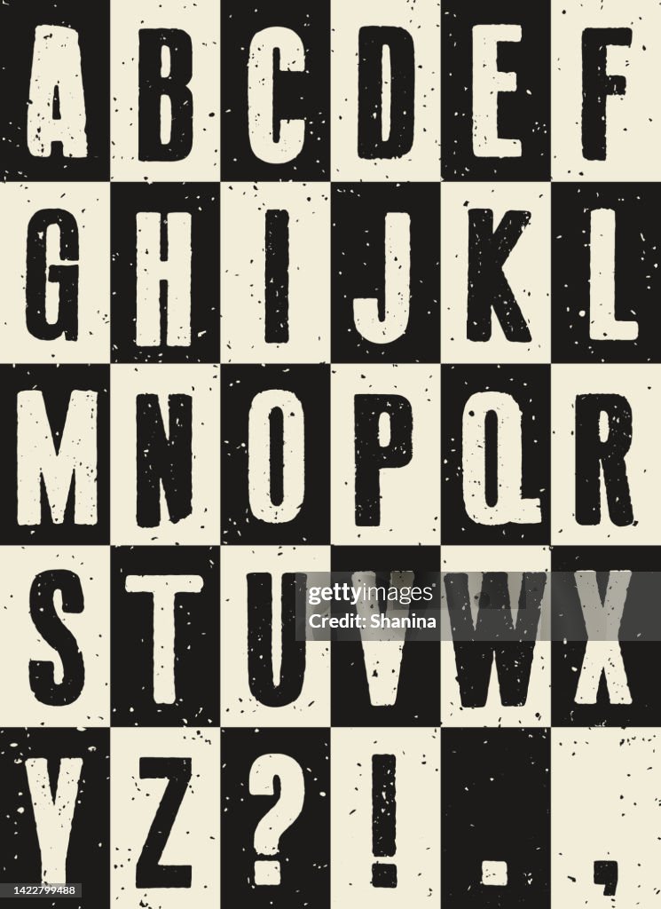 Black and White weathered alphabet on a grid