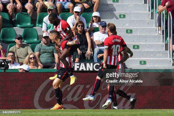 Oihan Sancet of Athletic Club celebrates with teammates after scoring their team's second goal from the penalty spot during the LaLiga Santander...