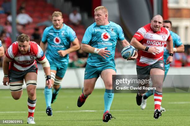 John Ryan of Wasps Rugby runs with the ball after breaking through the Gloucester Rugby defence during the Gallagher Premiership Rugby match between...