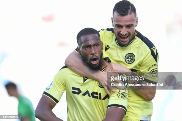 Beto of Udinese Calcio celebrates with teammate Ilija Nestorovski after scoring their team's third goal during the Serie A match between US Sassuolo...