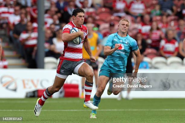 Louis Rees-Zammit of Gloucester Rugby breaks free of the Wasps Rugby defence to score their side's first try of the match during the Gallagher...