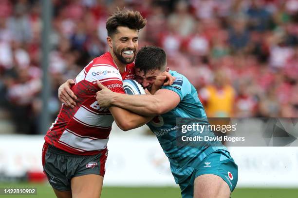 Adam Hastings of Gloucester Rugby is tackled by Sam Spink of Wasps Rugby during the Gallagher Premiership Rugby match between Gloucester Rugby and...