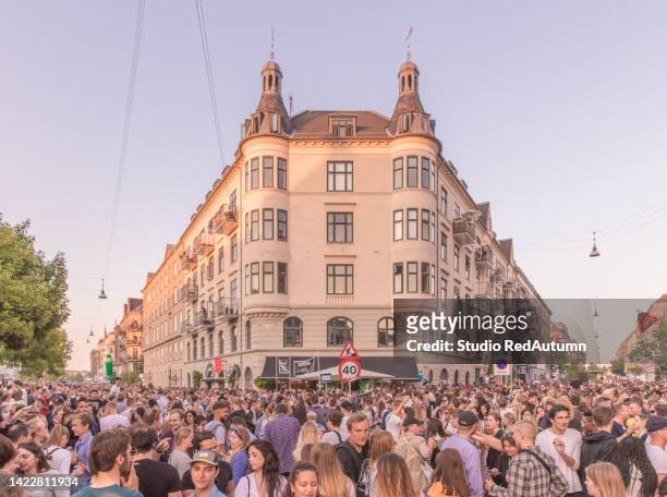 thousands of people enjoying the annual distortion street party in the summer of copenhagen, denmark - music, dance, food and drinks, showing the joy life in the old town street, may 31 - june 1 ,2018 - summer street party stock pictures, royalty-free photos & images