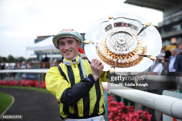 David Egan celebrates with the trophy after riding Eldar Eldarov to win the Cazoo St Leger Stakes at Doncaster Racecourse on September 11, 2022 in...