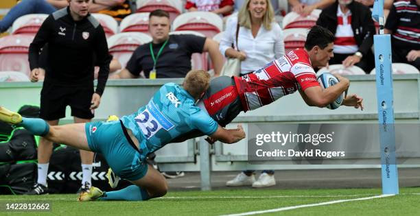 Louis Rees-Zammit of Gloucester dives over for their first try after making a solo break during the Gallagher Premiership Rugby match between...