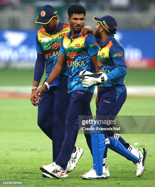 Kusal Mendis of Sri Lanka and Dasun Shanaka of Sri Lanka speaks to Dilshan Madushanka of Sri Lanka during the DP World Asia Cup Final match between...