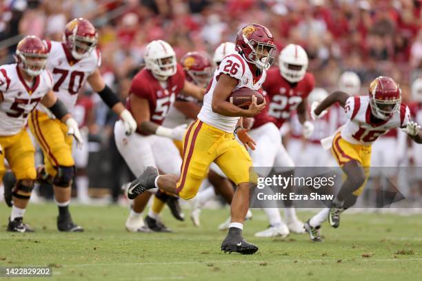 Travis Dye of the USC Trojans runs the ball in for a touchdown against the Stanford Cardinal at Stanford Stadium on September 10, 2022 in Stanford,...