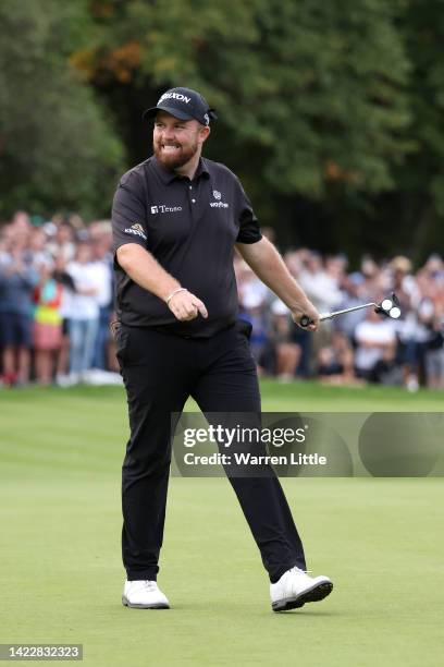 Shane Lowry of Ireland reacts after putting on the 18th hole during Round Three on Day Four of the BMW PGA Championship at Wentworth Golf Club on...