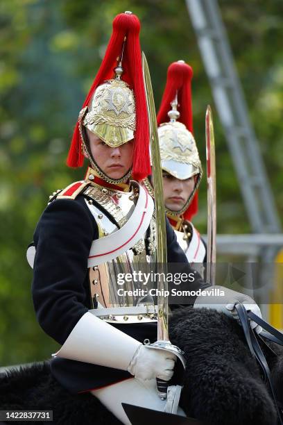 Members of the Household Cavalry Mounted Regiment ride down the Mall following the death of Queen Elizabeth II on September 11, 2022 in London,...